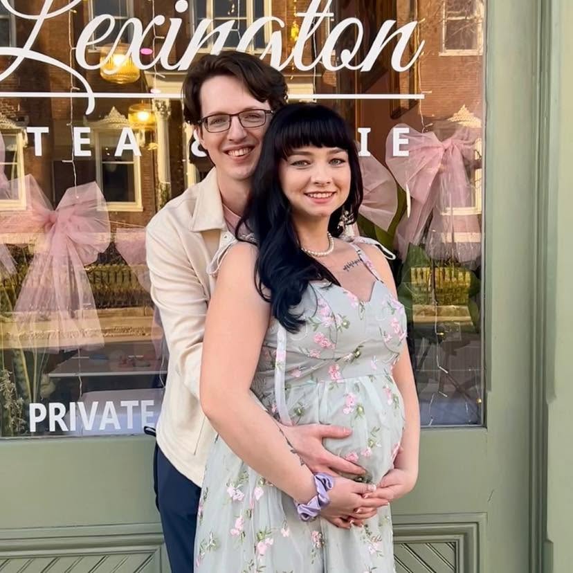 Tristan Ratliff smiling with a companion outside a storefront